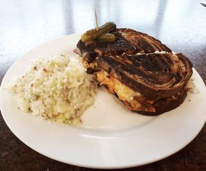 Smoked tofu Reuben served with potato salad. at V Food Spot in London
