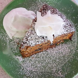 Vegan carrot cake with coconut cream at Festivus Cafe in Launceston