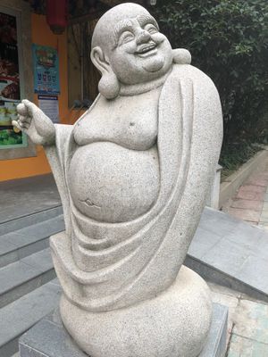 Welcoming statue at the entrance (clearly the eating is good!) at Ji Ming Temple Vegetarian Diet in Nanjing