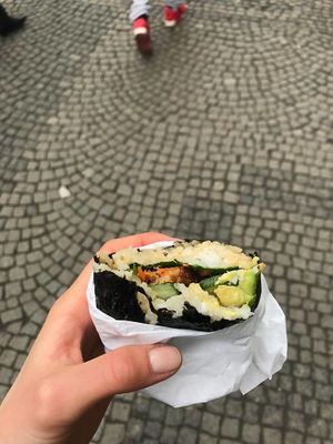 onigirazu with roasted tempeh, avo, veggies and sesame sauce at Onigirazu in Prague