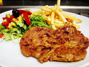 Homemade seitan with salad  and chips  at Rocket Café in Tenerife