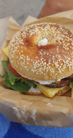 bagel sando on a sesame bagel bun with cream cheese at Soulshine in San Diego