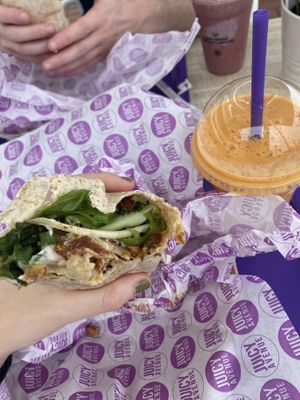 vegan hummus and ‘chicken’ burrito with sundried tomatoes and lettuce - smoothie with carrot, mango, passionfruit and soya milk  at Juicy Avenue in Gran Canaria