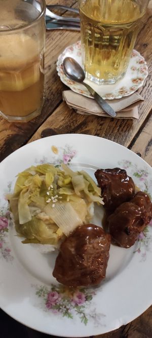 Seitan in a sweet sauce, with rice and leeks. at Au Bonheur des Chats in Lyon