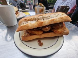 Posh roll - sausage, fried onion and hash brown at The Glasvegan in Glasgow