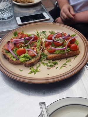 Avo on toast with tomato, red onion and coriander at The Glasvegan in Glasgow