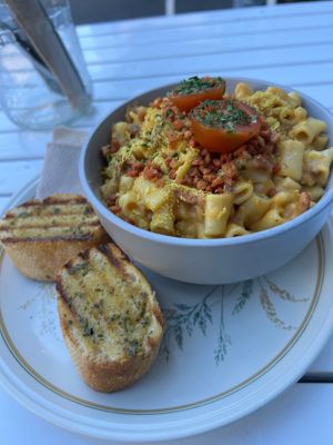 Vegan Mac & cheese with bacon bits and garlic bread yummy! at The Glasvegan in Glasgow