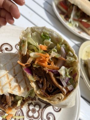 Doner Vebab: Doner “Mheat” with lettuce, cabbage, carrots, onion, and garlic sauce on a regular wrap. Basically just a wrap with some lunch meat. Missing something else savory  at The Glasvegan in Glasgow