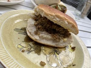 Haggis Breakfast Sandwich w/ brown sauce! The “haggis” was great and had the texture and flavor of American Stuffing. Non-vegan said the flavor wasnt the same as real haggis  at The Glasvegan in Glasgow