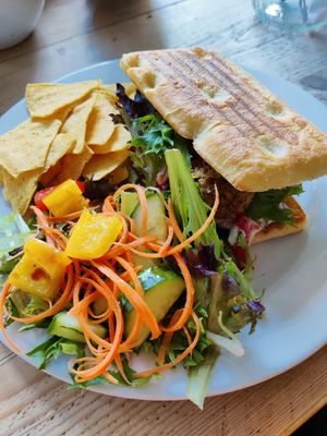 Falafel sandwich with salad and tortilla chips at The Glasvegan in Glasgow