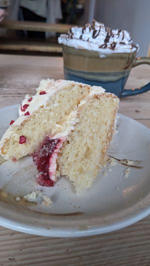 Lemon and raspberry cake with hot chocolate at The Glasvegan in Glasgow
