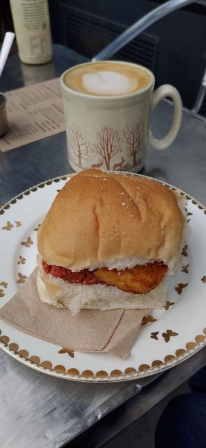 Square sausage and hash brown roll with latte at The Glasvegan in Glasgow