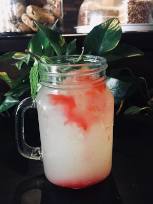 Fresh Squeezed Lemonade, mint leaf, lime and a splash of strawberry  at The Queen's Table Vegan Cuisine  in El Paso