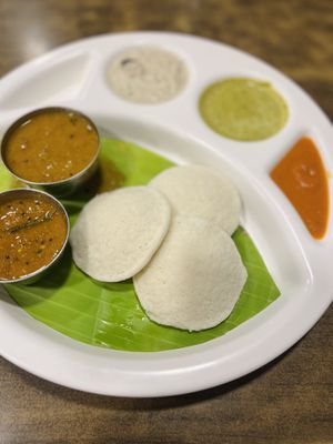 “3 idlis” - served with chutneys and sambar  at Hotel Saravana Bhavan - Connaught Circus in New Delhi