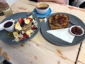 pancakes with banana & strawberries, raisin toast & coffee with almond milk at The Farmer's Wife in Port Fairy