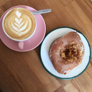 Maple smoked coconut donut and cappuccino  at Brammibal's Donuts - Prenzlauer Berg in Berlin