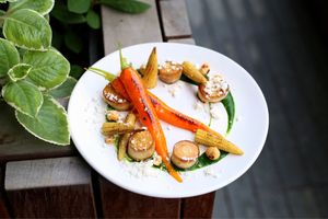 “Scallops” king oyster mushroom, spinach puree, garlic snow, baby carrot, baby corn, toasted hazelnuts, lemon zest. Photo provided by HRVST  at HRVST by Kilter Avenue in Central Singapore