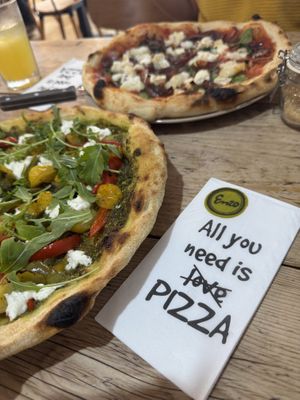 Pesto Deluxe Pizza with tomatoes, peppers, vegan feta, rocket and a pesto base  at Enzo in Nantwich