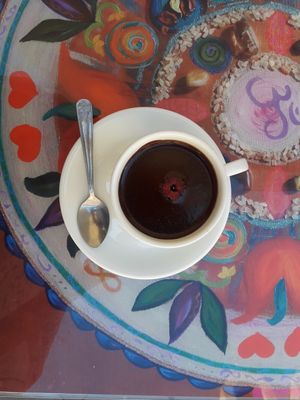 hot chocolate with dates and a raspberry at Bez Lukru in Wroclaw