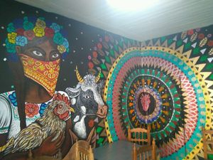 Mural por Razúl at Cafeteria Vegana Les Gords in Mexico City