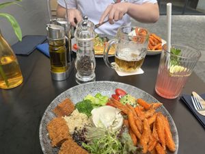 Vegan Buddha bowl (and goats cheese and ham omlette at back)   at Cafe Elektric in Prague