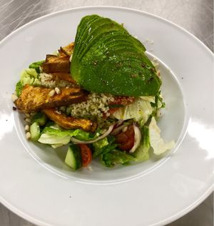 Quinoa salad with baked sweet potatoes and avocado  at Cafe Elektric in Prague