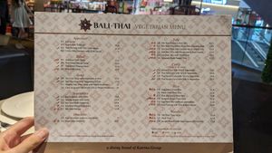 1-page dairy-free vegetarian menu; egg and alliums labelled clearly at Bali Thai - Causeway Point in North Singapore