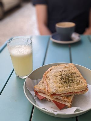 'ham and cheese toastie' with pineapple juice at Moko Veggie Cafe - Anjos in Lisbon