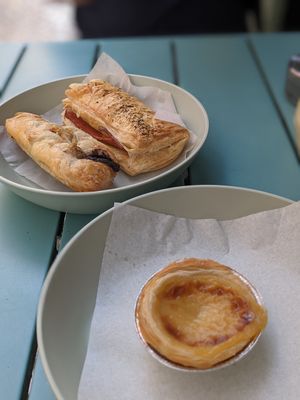 'bacon' roll, chocolate pastry and pastel de nata at Moko Veggie Cafe - Anjos in Lisbon