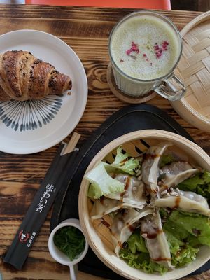 Dumplings, chocolate croissant, matcha latte    at Moko Veggie Cafe - Anjos in Lisbon