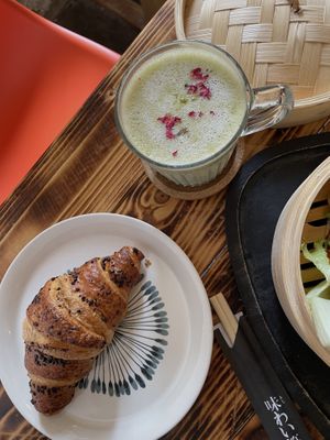 Chocolate croissant and matcha latte   at Moko Veggie Cafe - Anjos in Lisbon