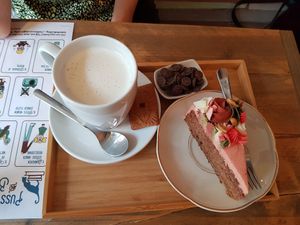 Banana bread and hot chocolate with soy milk at Puss and Books in Bruges