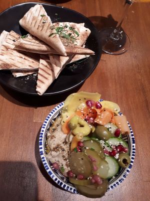 Pickles, hummus and pita at Falla in Warsaw