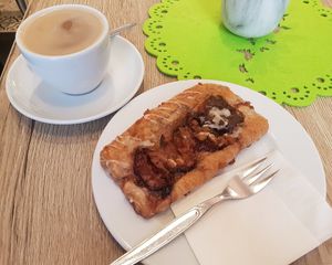 Coffee with oat milk & Zwetschgentasche at Organic Bakery Postler in Bamberg