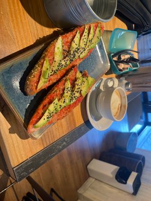 Avocado tomato on multigrain with almond milk lattee  at La General in Madrid