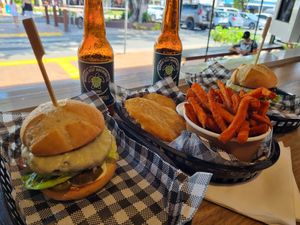 Vegan burger with vegan cheese,  potato scallops and sweet potato fries with vegan mayo at N17 Burger Co in Port Douglas