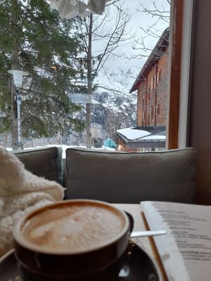 Cappuccino and a view over the mountains at Café LIV in Murren