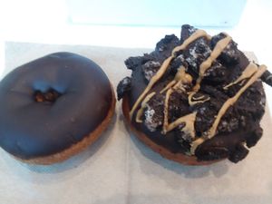 Vegan chocolate cake donut and vegan ODB donut at Universal Studios - Voodoo Doughnut in Orlando