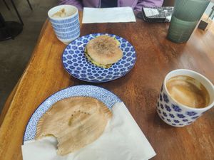 Jamaican pattie, English muffin & coffees at Kranky Cafe in Vancouver