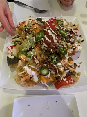 Loaded nachos about 4 times bigger than we expected for an appetizer  at The Modern Vegan in Las Vegas
