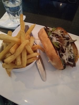 Philly and fries. This plus the popcorn chickn, daiquiri, and my bf's Alfredo pasta racked us up a bill of over $60 before tip... Insanity!  at The Modern Vegan in Las Vegas