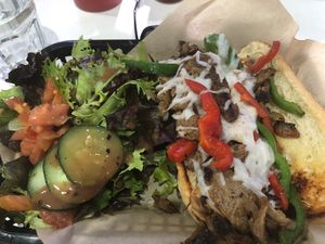 Philly cheese steak with salad  at The Modern Vegan in Las Vegas