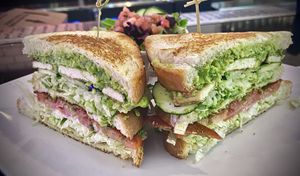 TMV CLUB
Bacon, grilled tofu, lettuce, mayo, tomato, cucumber, guac and pesto, on a triple decker stack of toasted sourdough.  at The Modern Vegan in Las Vegas