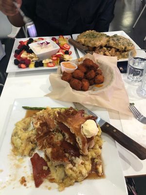 Chicken & waffles, cheddar bites, fruit platter, biscuits & gravy at The Modern Vegan in Las Vegas