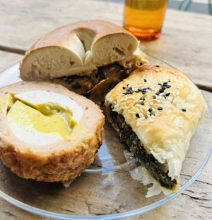 Scotch “egg”, bagel with tofu, “cream cheese” and kimchi, spanakopita   at Harmless in North London