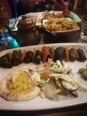 Stuffed grape vine leaves Platter with Syrian chips. Behind is Falafel platter at Damascus Gate in Dublin