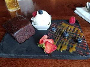Vegan brownie with berries and soya ice cream at The Courthouse Bar in Douglas