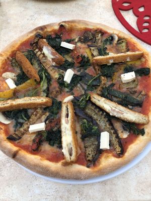 Pizza with veggies, vegan cordon Bleu, vegan cheese and feto (fermented tofu) at Kamels in Bad Bergzabern