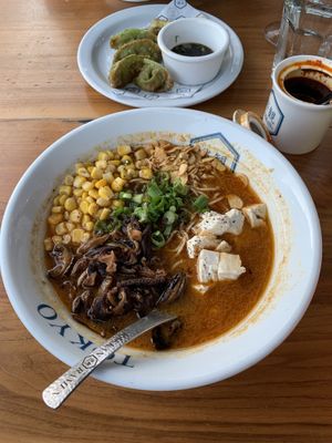 Spicy ramen and gyoza  at RAKKAN Ramen - DTLA in Los Angeles