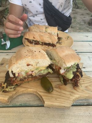 Torta chorizo (further away), torta Cubana (closer)  at Huitzilli Saludable in Merida